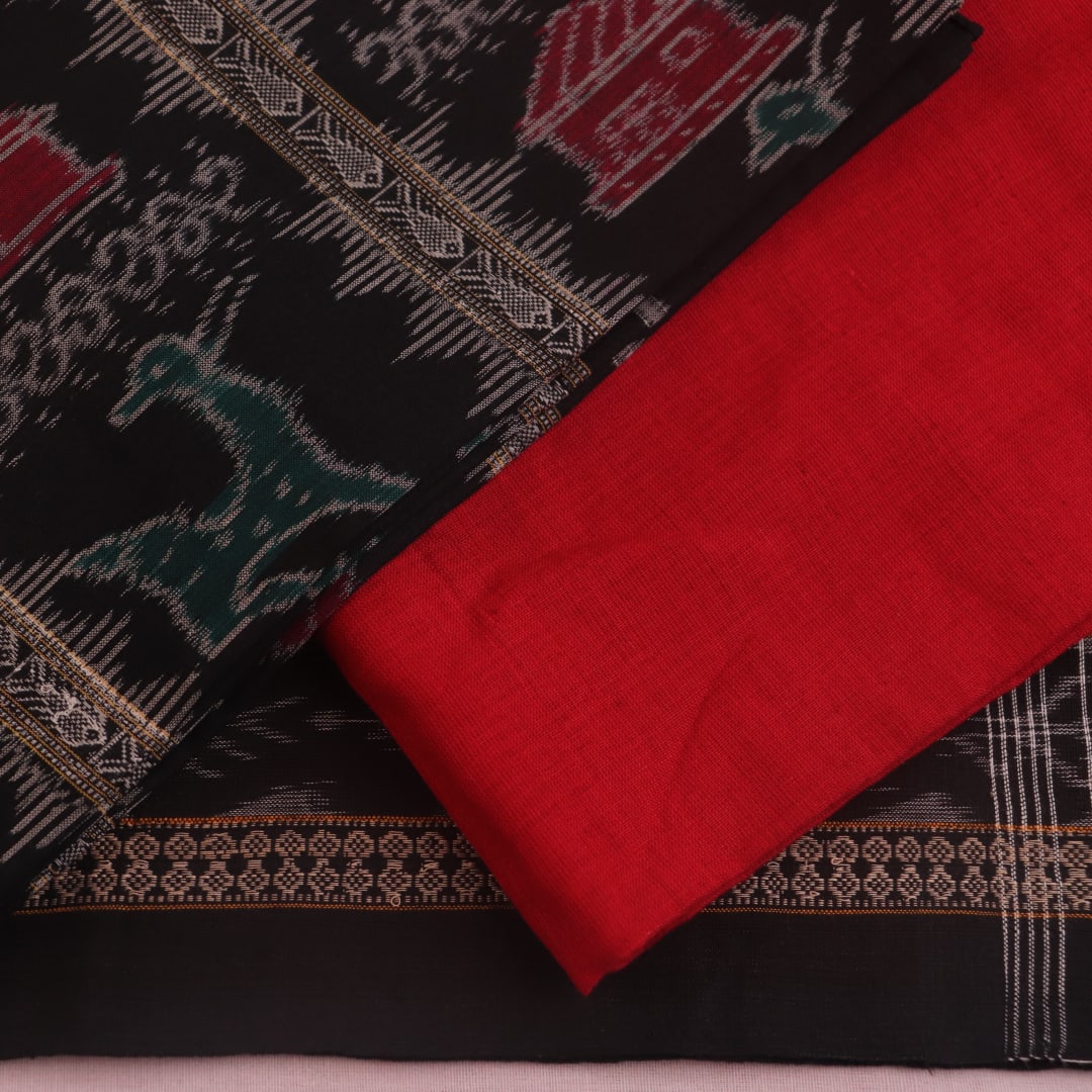 Detail of the black Sambalpuri cotton dress material's blouse piece with red motifs.