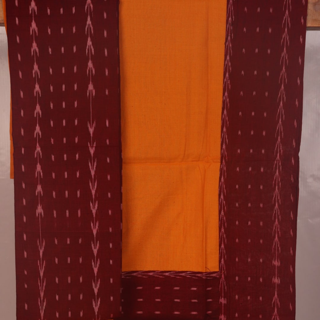 Detail of maroon and yellow motif Sambalpuri cotton dress material blouse piece.