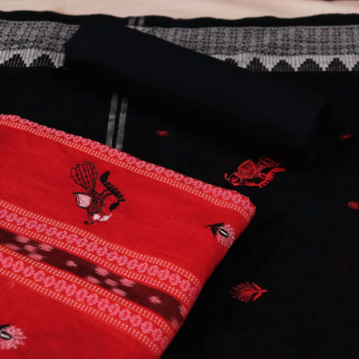 Close-up of red cotton Sambalpuri dress material with intricate black motifs