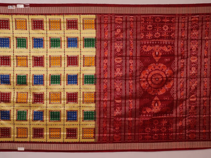 Close-up of multicolored Sambalpuri silk saree fabric texture showing intricate weave and maroon accents.
