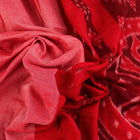 Styled plain pink and red Sambalpuri cotton saree, highlighting its elegant drape and material flow.