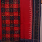 Detail of the red Sambalpuri cotton dress material's blouse piece with motifs.