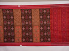 Model draped in brown and red Pasapalli Sambalpuri cotton saree showcasing traditional Odisha handloom