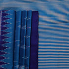 Full view of a blue Khandua silk saree featuring intricate motifs woven into the fabric.