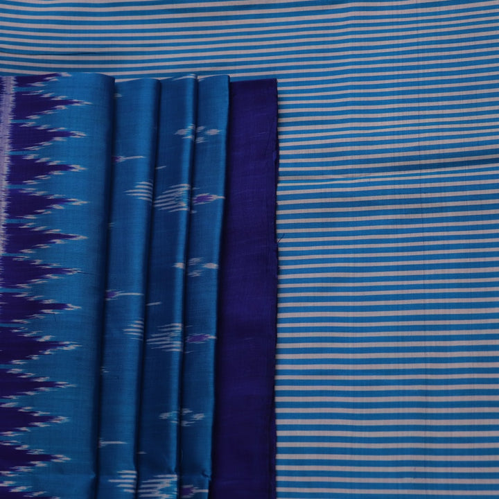 Full view of a blue Khandua silk saree featuring intricate motifs woven into the fabric.