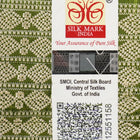Close-up of the luxurious texture of the white Sambalpuri Silk Saree, revealing the fine weave and motif details.