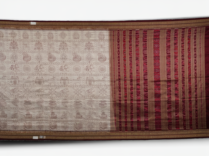 Close-up of the fine silk texture of the white Sambalpuri saree, highlighting its soft sheen and weave.