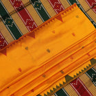 Close-up of yellow & green Sambalpuri Silk Saree fabric texture, showing Butta pattern.
