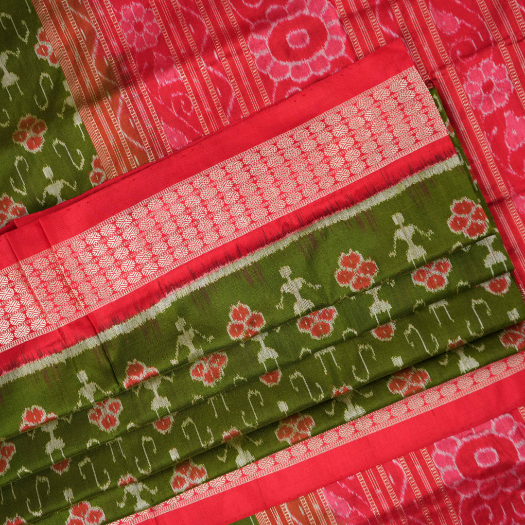 Close-up showing the rich, smooth texture of the green Sambalpuri Silk Saree's weave, highlighting its quality.