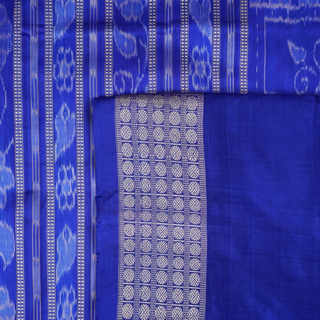 Close-up showing the luxurious handloom silk fabric texture and fine weave of the pink Sambalpuri saree.