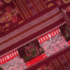 Model wearing a multi-color and maroon Sambalpuri cotton saree in a traditional Pasapalli weave