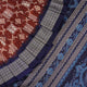Close-up of the rich silk fabric texture of the Sambalpuri Saree, showing the intricate weave and slight sheen.