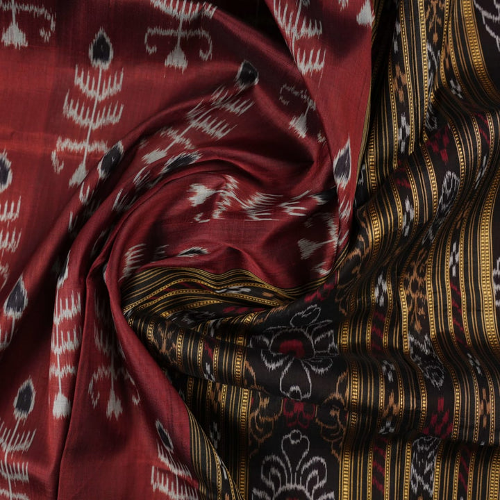 Full styling view of an elegant brown and black Khandua silk saree draped on a model for a classic look.