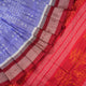 Close-up of the luxurious silk texture of the violet and maroon Sambalpuri Saree fabric.