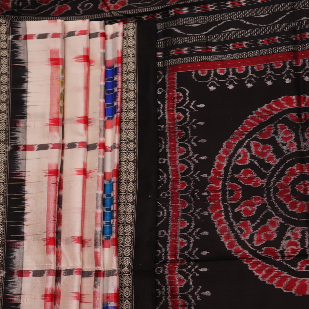 Close-up of white silk handloom saree with black Sambalpuri motifs