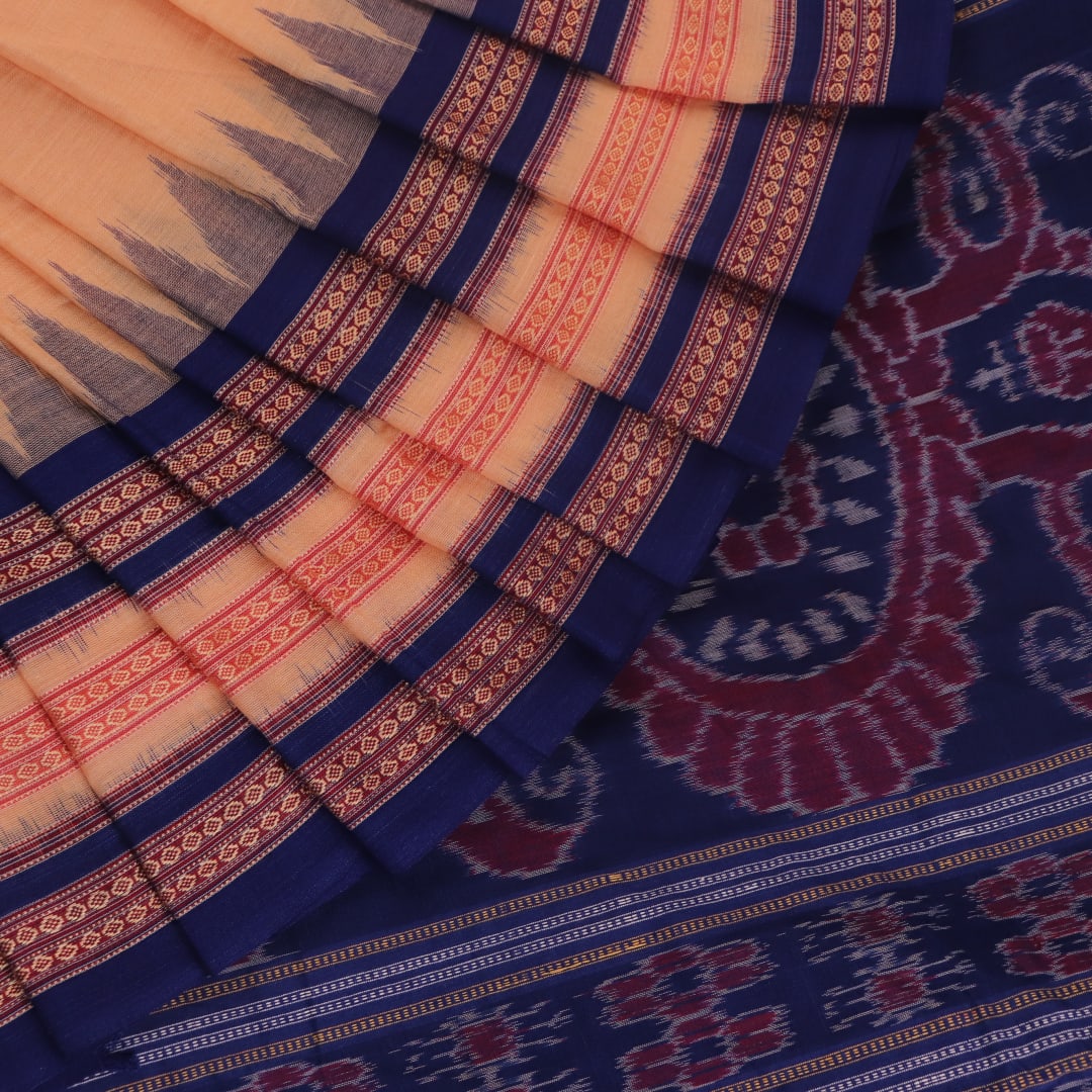 Cream cotton Bomkai saree with blue butta pattern, full view.