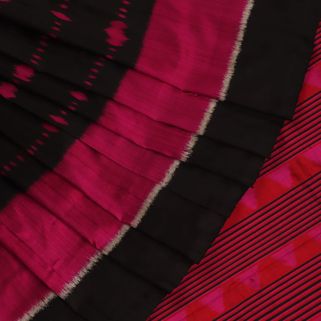 Full view of an intricately patterned black silk Khandua saree with black motifs