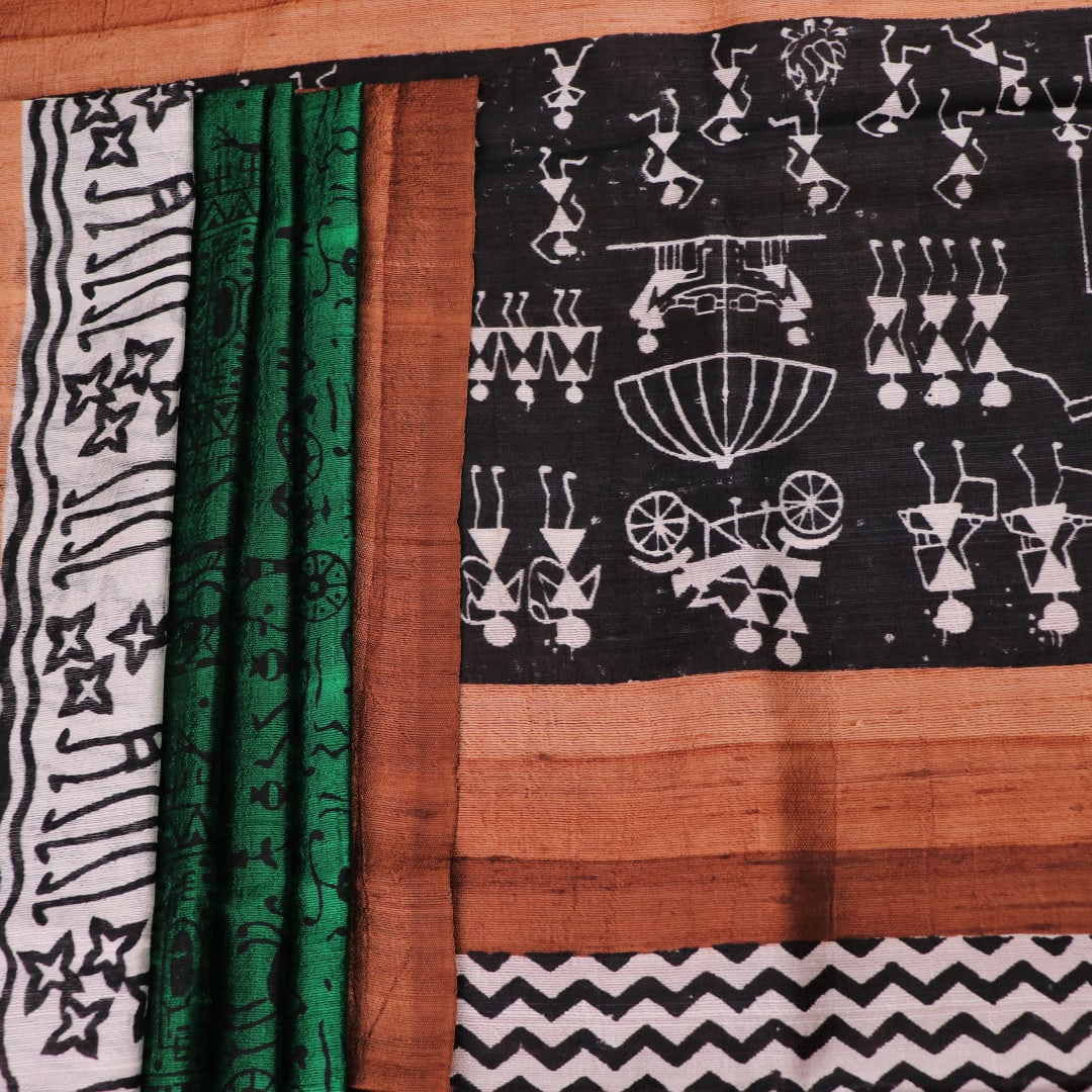 Full view of a green and brown Tussar silk saree featuring traditional motifs throughout the body.