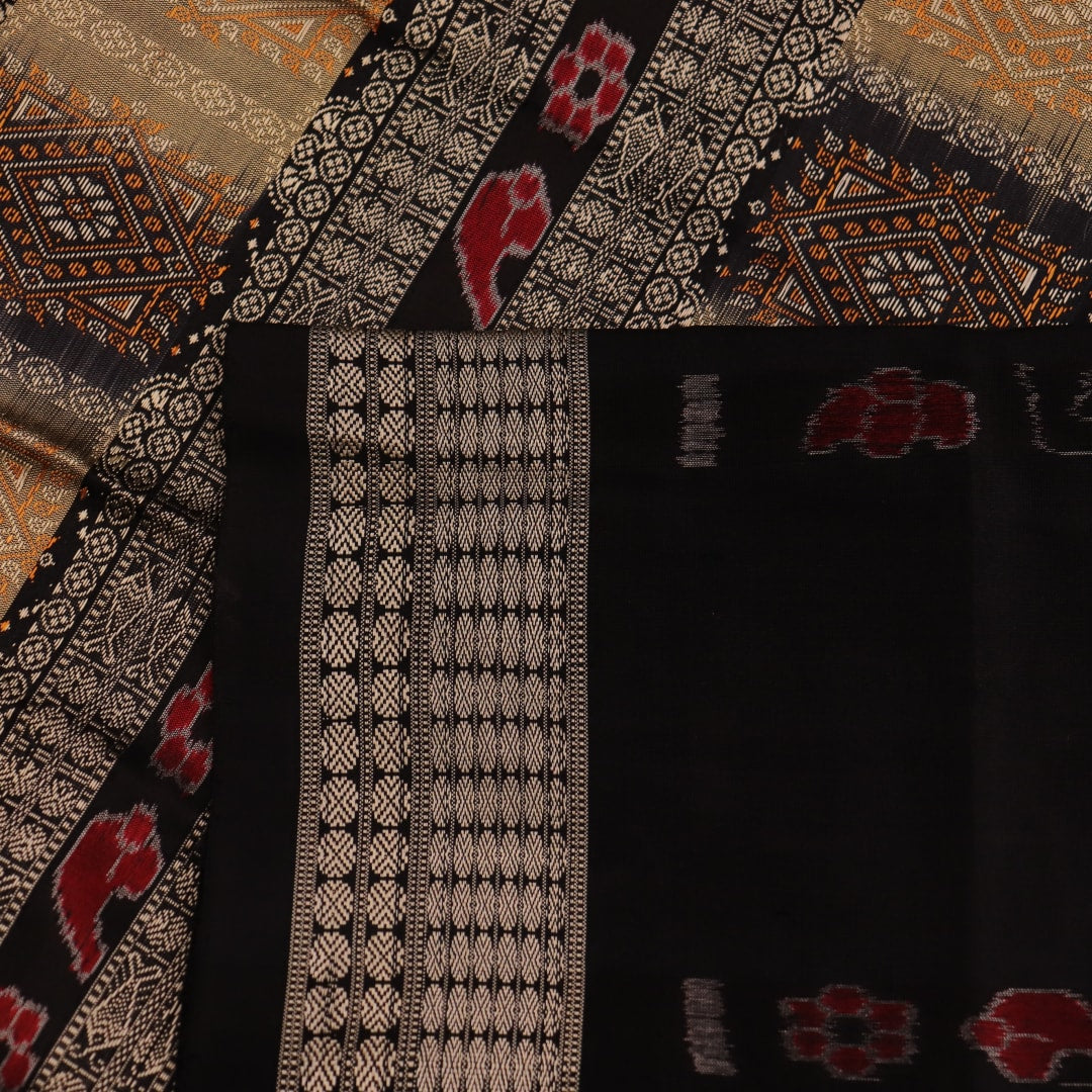 Close-up view of the vibrant and intricate silk fabric texture of a multicolored Bomkai silk saree with a black butta pattern.