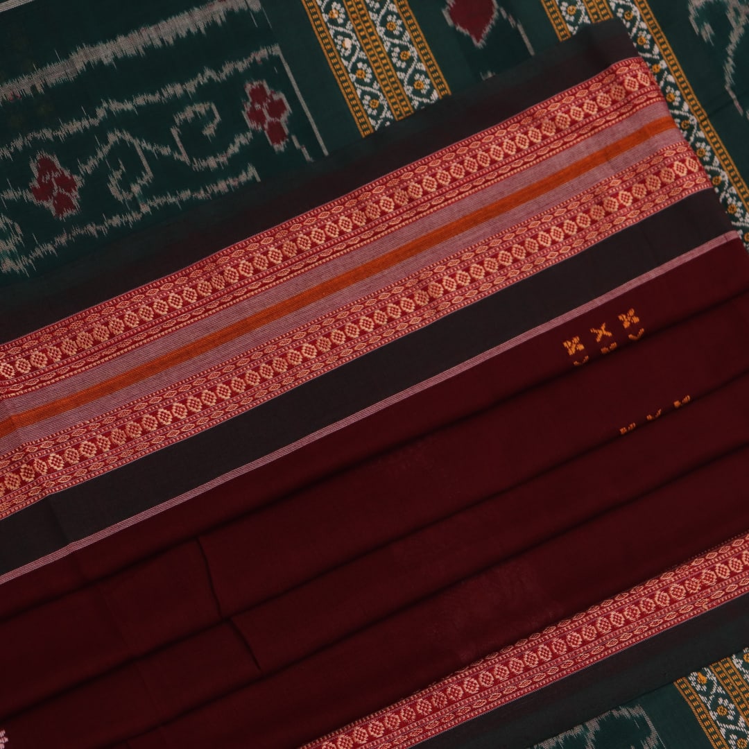 Full view of a maroon and green cotton Bomkai saree with a butta pattern.