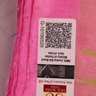 Close-up of green and pink plain Sambalpuri silk saree fabric texture.