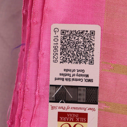 Close-up of green and pink plain Sambalpuri silk saree fabric texture.