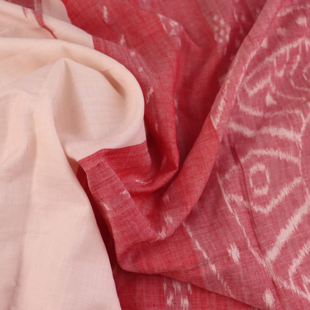 Plain white and maroon Sambalpuri cotton saree styled to show its drape and color combination.