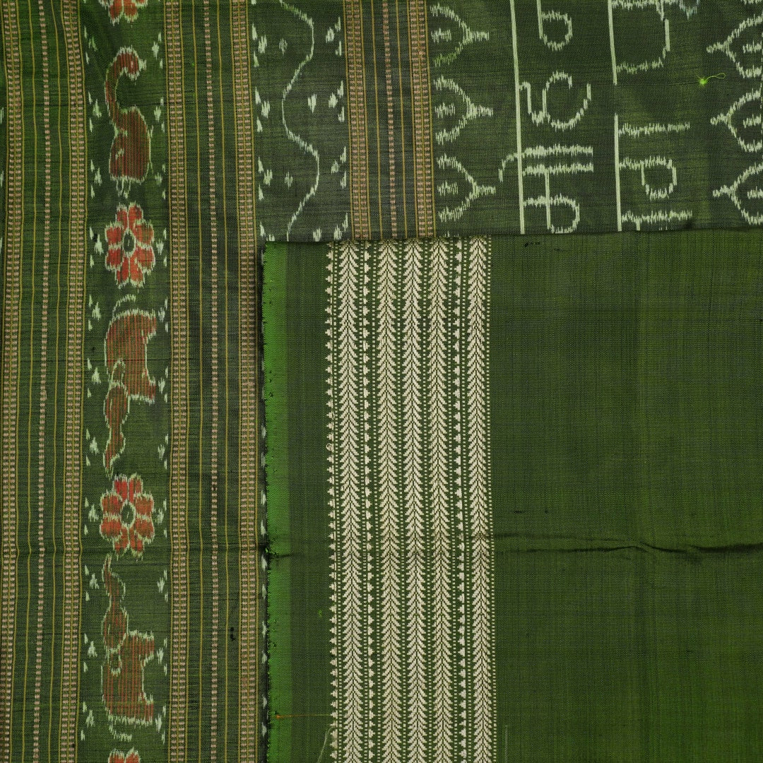Ultra close-up of green Sambalpuri silk fabric, revealing its unique texture and fine weave.