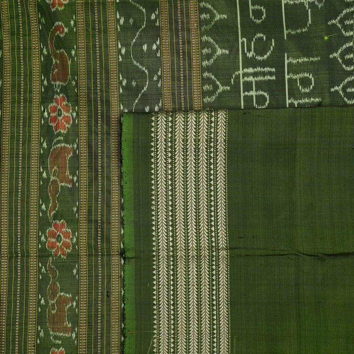 Ultra close-up of green Sambalpuri silk fabric, revealing its unique texture and fine weave.