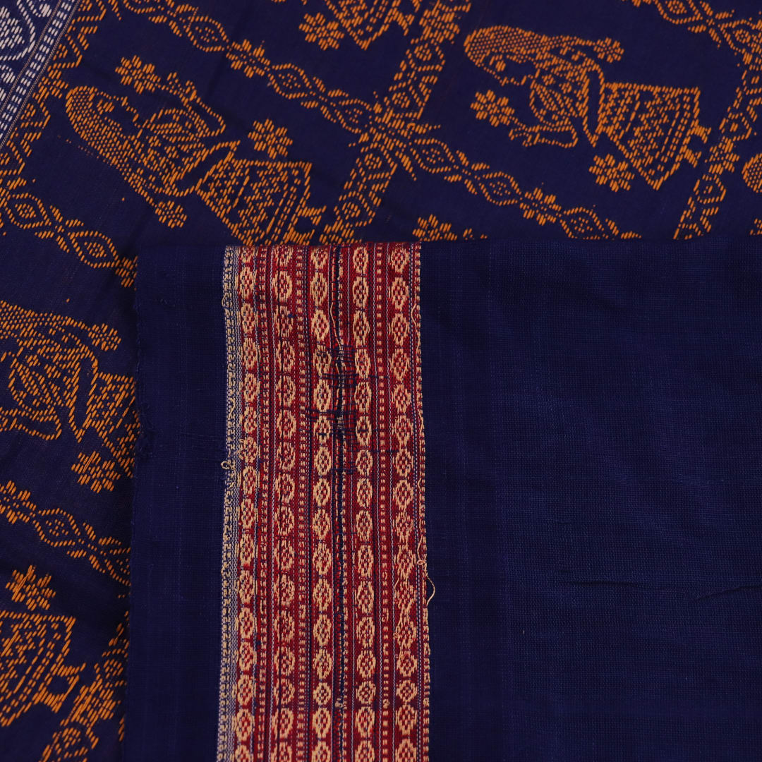 Full view of a handloom Bomkai saree in grey and blue with butta motifs.