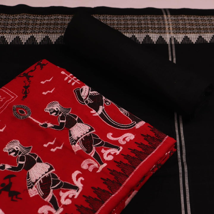 Close-up showcasing the intricate doll pattern on the cotton sambalpuri dress material in red and black.