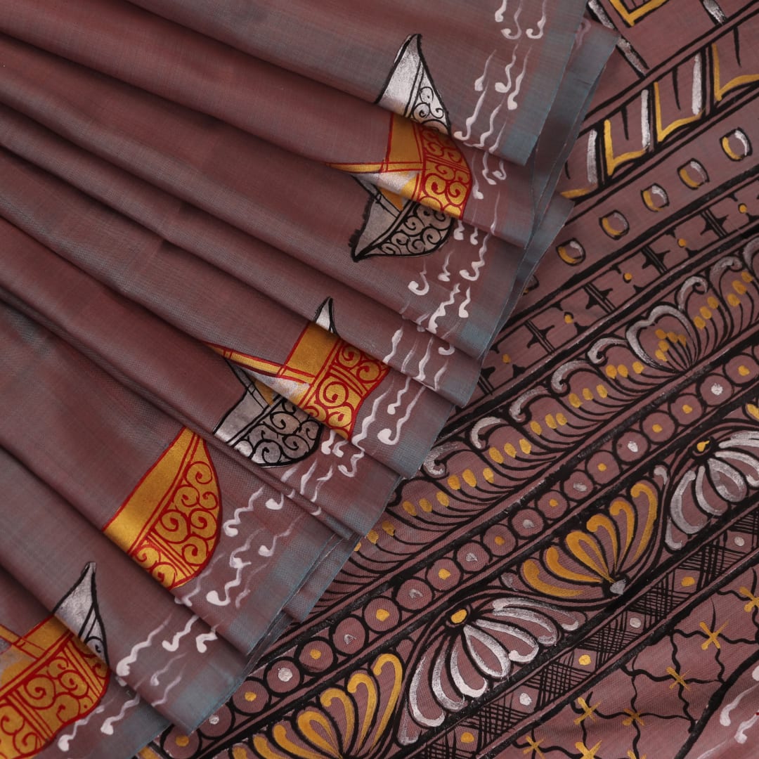 Close-up of multicolored Patachitra silk saree fabric texture showing hand-painted details.