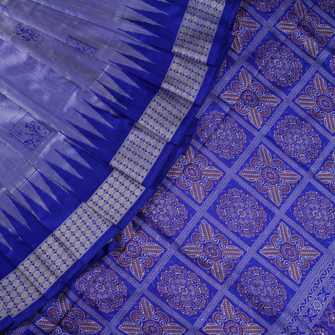 Ultra close-up of Bomkai Silk Saree fabric, highlighting the exquisite grey and blue weave texture.