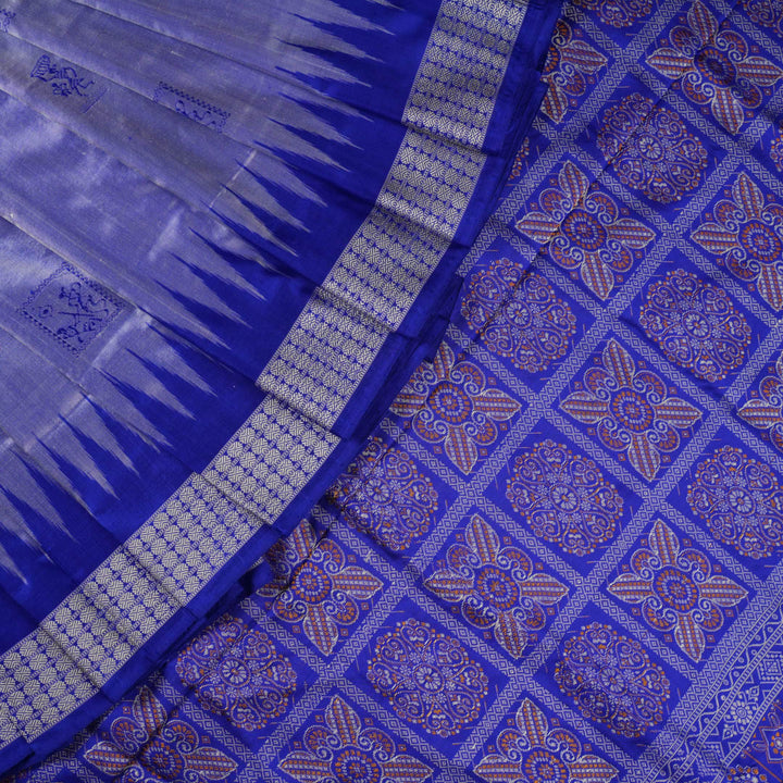 Ultra close-up of Bomkai Silk Saree fabric, highlighting the exquisite grey and blue weave texture.