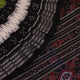 Styled green and black cotton Sambalpuri handloom saree with motifs, showcasing its elegant drape.