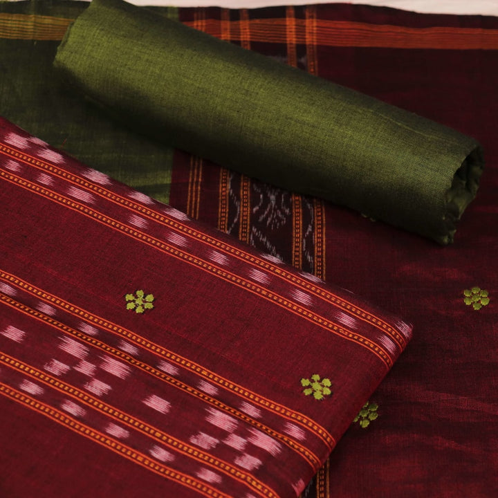 Detail view of the blouse piece with intricate Sambalpuri motifs in maroon and green on cotton fabric.