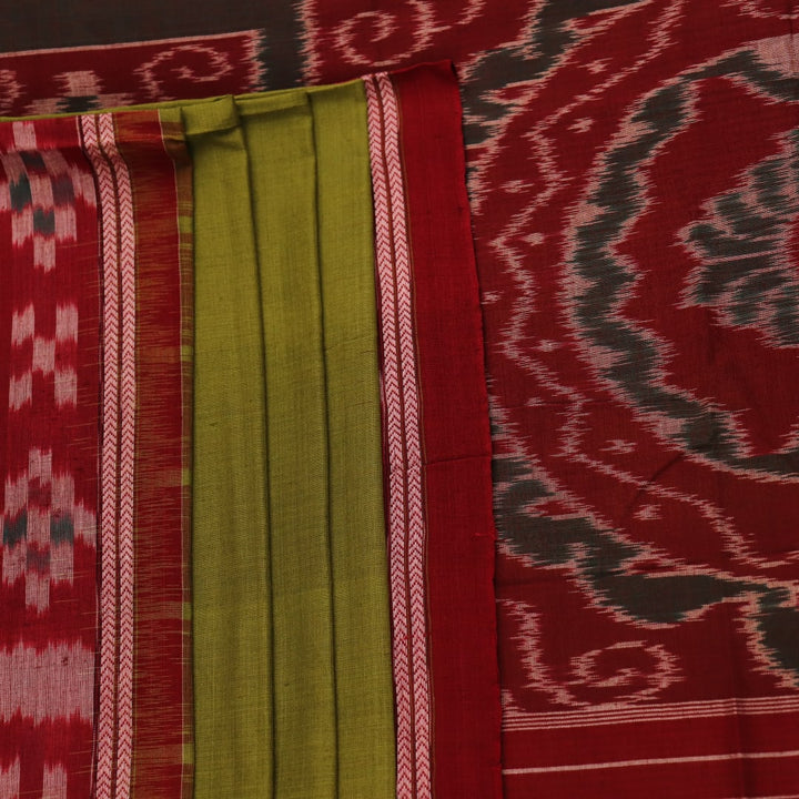 Green and maroon cotton Sambalpuri saree draped on a model, showcasing the Pasapalli pattern.