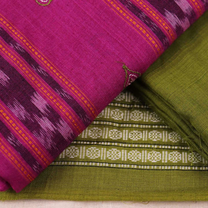 Close-up of blouse piece in magenta cotton with green Sambalpuri motifs