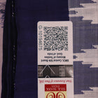 Close-up of white and blue Sambalpuri Silk Saree fabric texture, highlighting butta pattern.