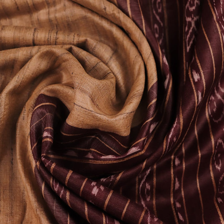 Close-up view of the textured Tussar Silk fabric of a Cream and Maroon Plain Tussar Saree