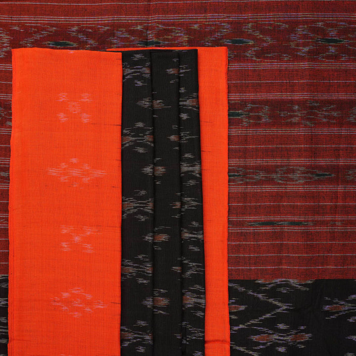 Elegant model styling of a black and orange Sambalpuri cotton saree showcasing the complete handloom look.