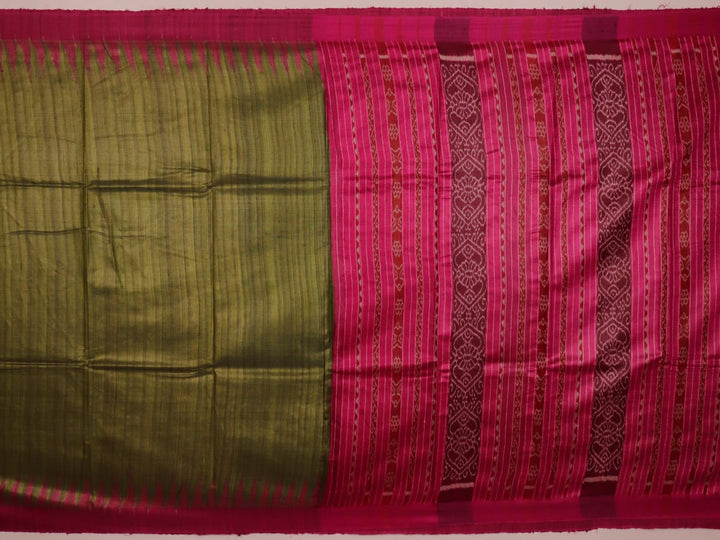 Close-up view of the luxurious texture of a plain green Tussar silk saree with a magenta border