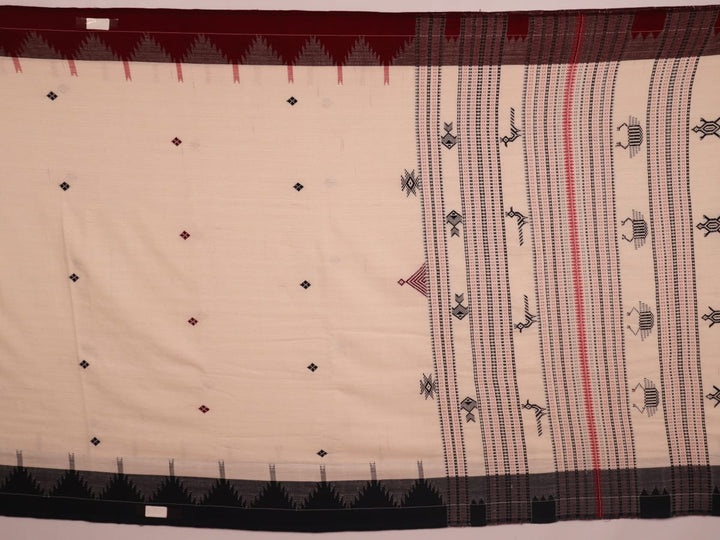 Full view of a white cotton Kotpad saree with a maroon border and butta pattern