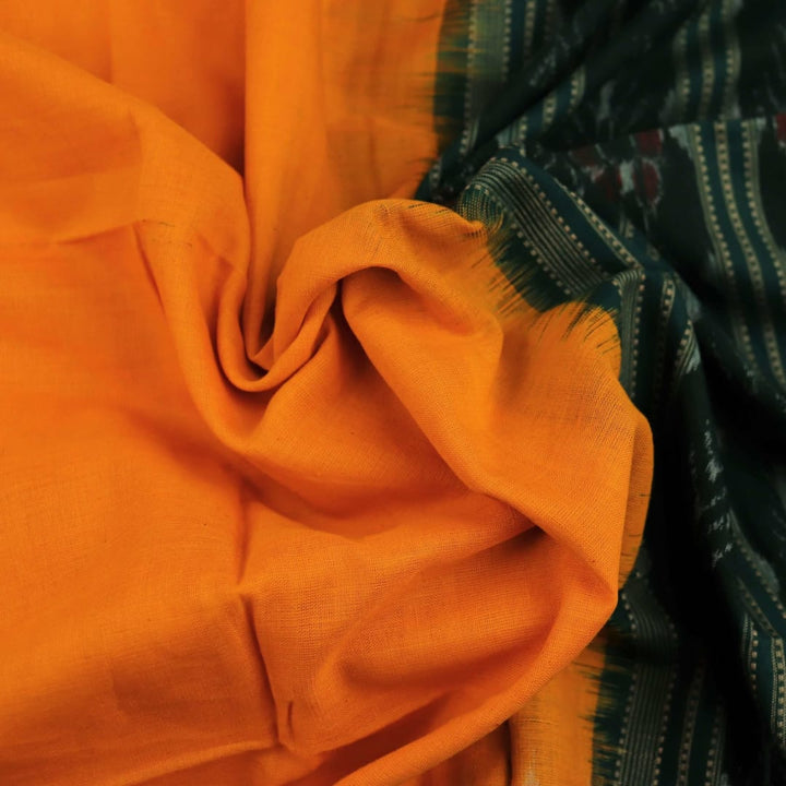 Yellow Sambalpuri cotton dupatta styled with a green blouse piece, draped over a model