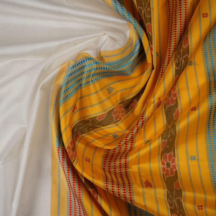 Close-up of the smooth texture and plain weave of white Sambalpuri silk fabric.
