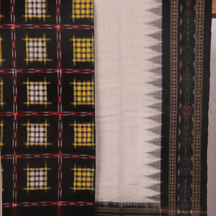 Detail of the black and white Sambalpuri cotton dress material's blouse piece with motifs.