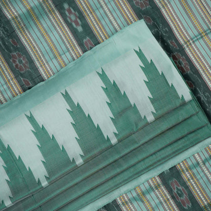 Extreme close-up of the green Sambalpuri silk fabric, revealing its luxurious texture and fine handloom weave.