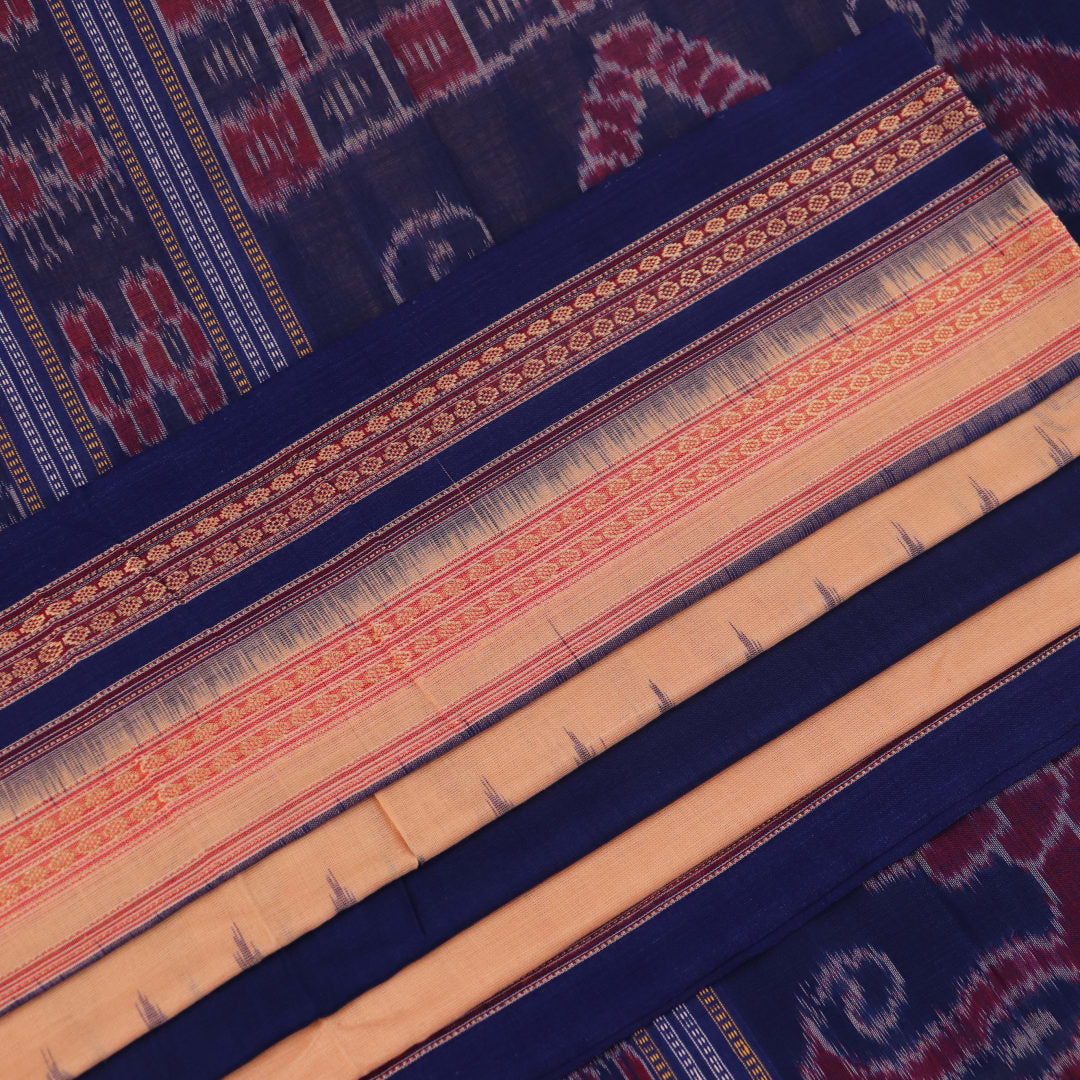 Cream cotton Bomkai saree with blue butta pattern, full view.