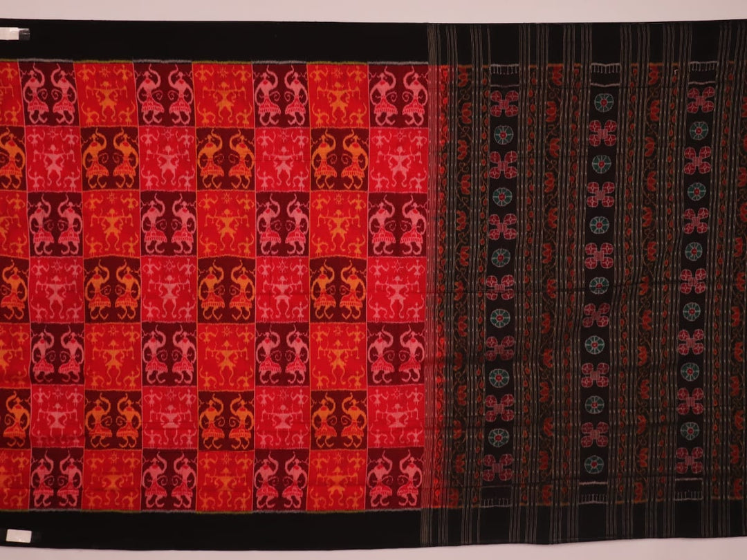 Full view of maroon and black cotton Sambalpuri saree showcasing intricate motifs on the body and border.