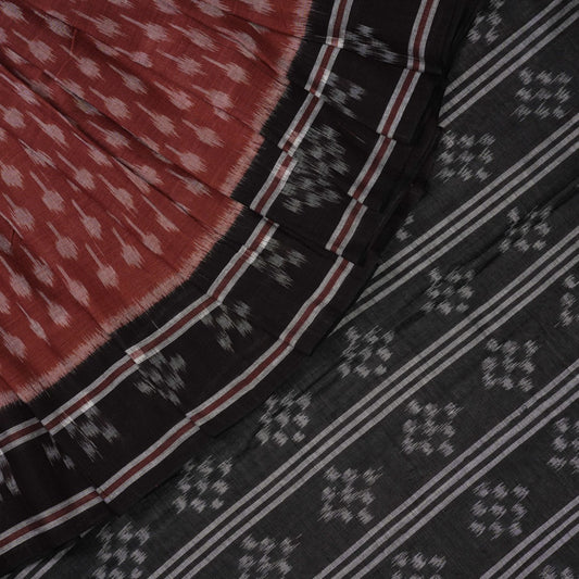 Full styling view of a model draped in a brown and black Sambalpuri cotton saree with traditional motifs.